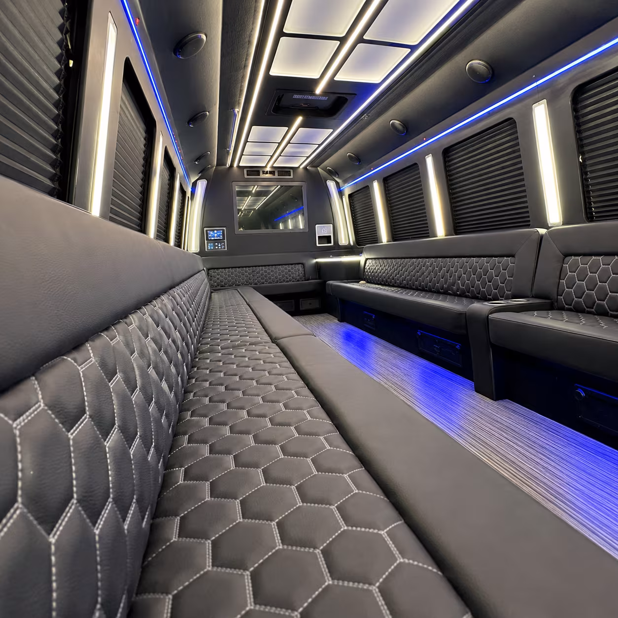 Wedding guests seated inside a party bus serving Aurora