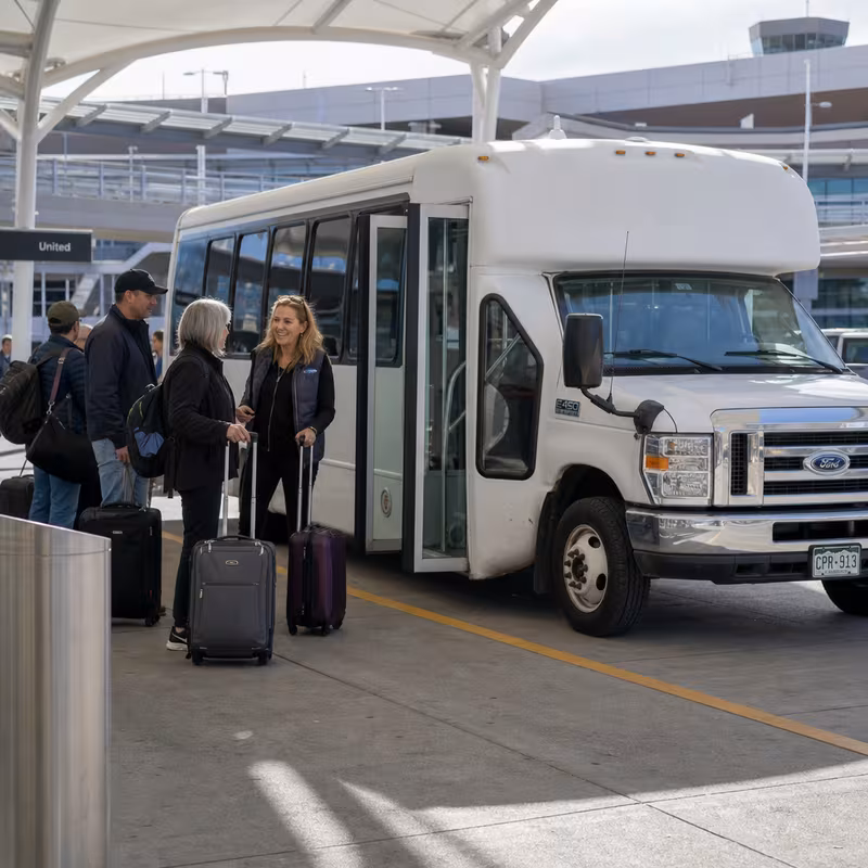 Black Mercedes Sprinter van staged for an Aurora Airport Transportation group