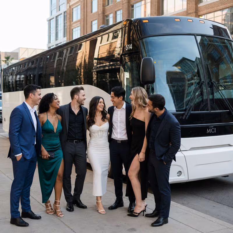 Passengers loading luggage while boarding an Aurora group shuttle