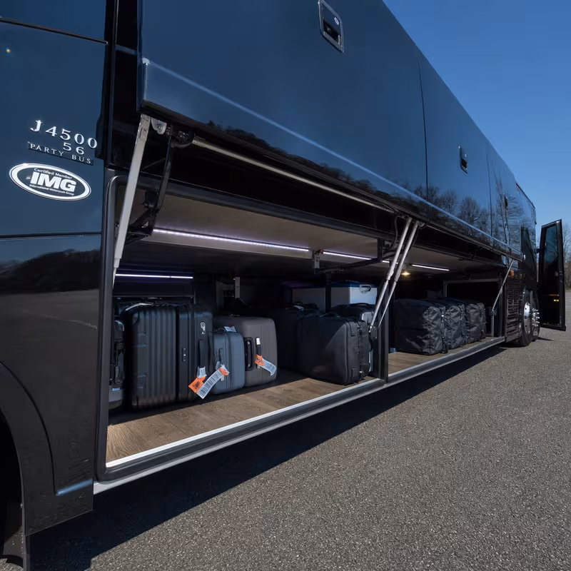 Party bus interior with wraparound leather seating and LED lighting in Aurora