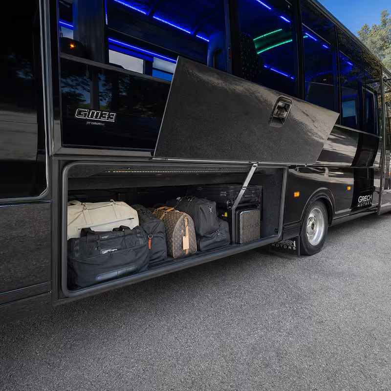 Party bus interior with wraparound leather seating and LED lighting in Aurora