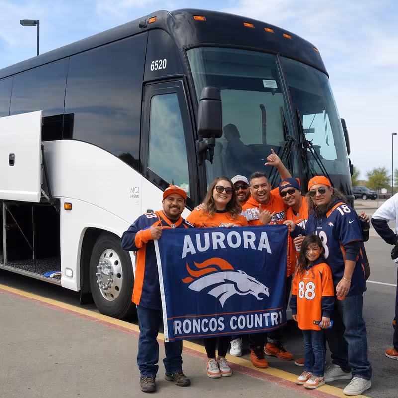 Passengers loading luggage while boarding an Aurora group shuttle