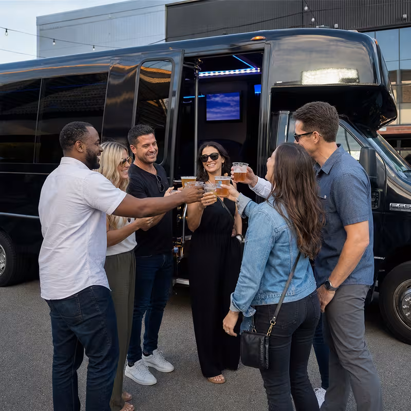 Passengers loading luggage while boarding an Aurora group shuttle